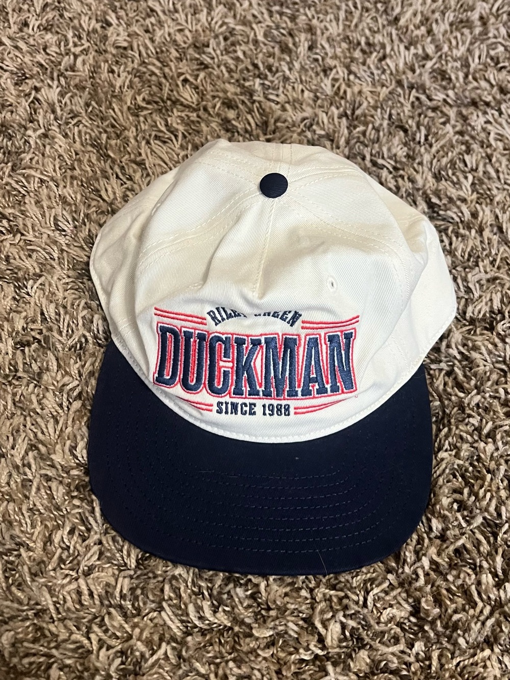 Riley Green Duckman Embroidered Baseball Cap in White and Navy